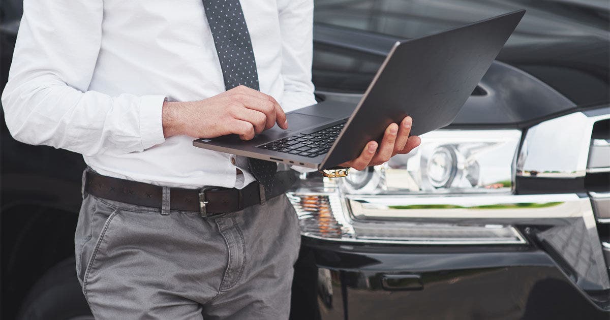 Man is a man working on a laptop and testing on mobile devices, Man is a man working on a laptop and testing on mobile devices