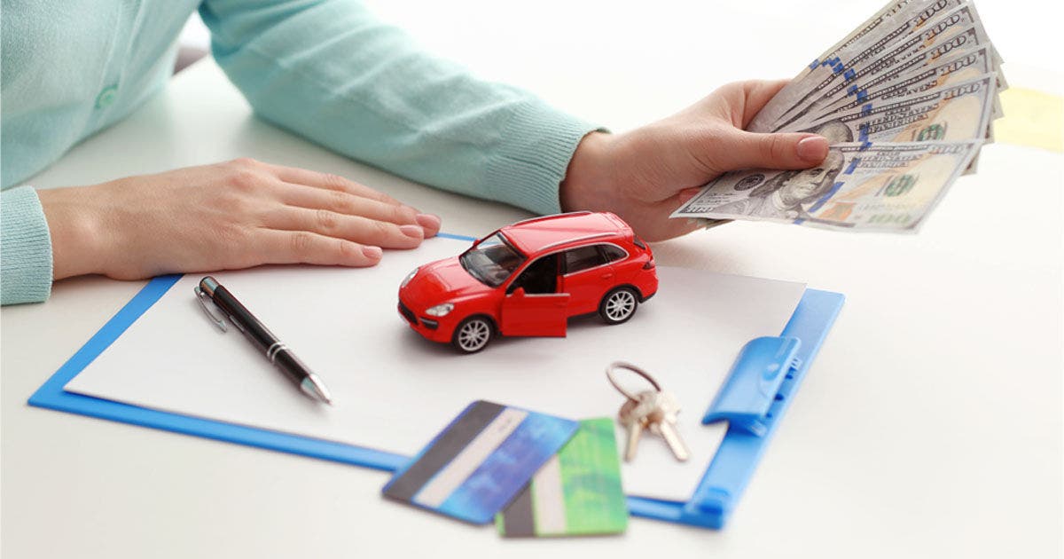 Buying  a new car concept. Hands holding money.